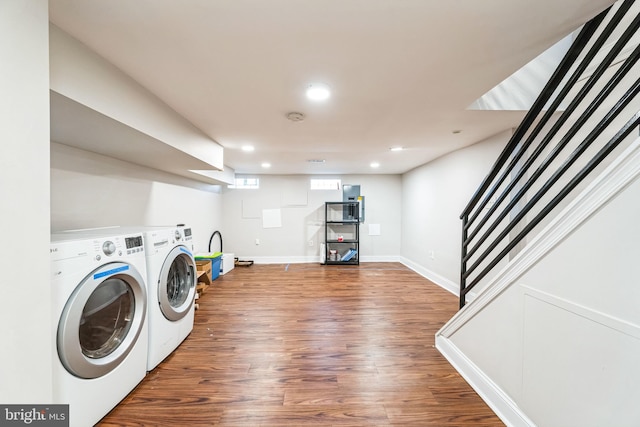 washroom with baseboards, separate washer and dryer, wood finished floors, and recessed lighting