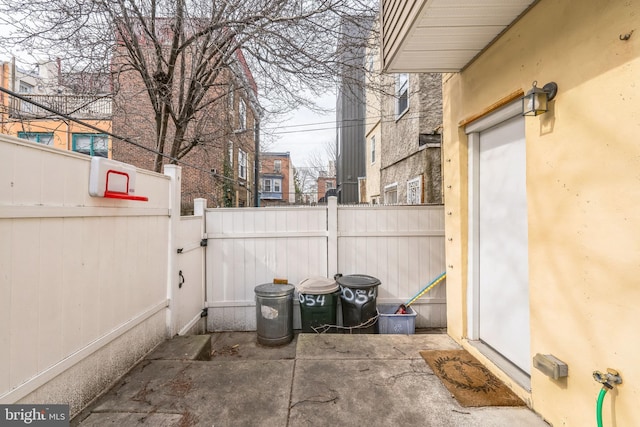 view of patio featuring fence