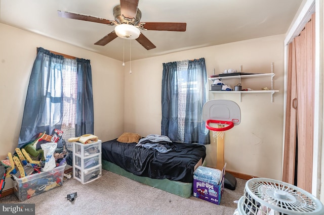 bedroom with ceiling fan and carpet flooring