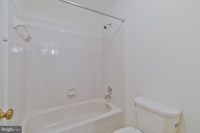 bathroom with toilet and bathtub / shower combination