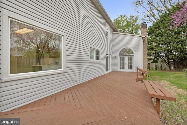deck with french doors and fence