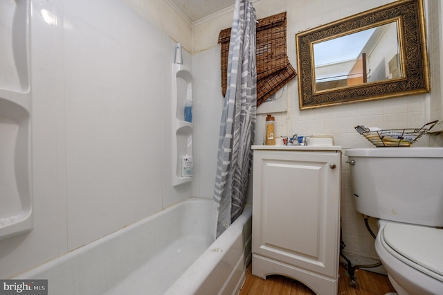 full bathroom featuring hardwood / wood-style flooring, toilet, tile walls, shower / bath combo, and vanity