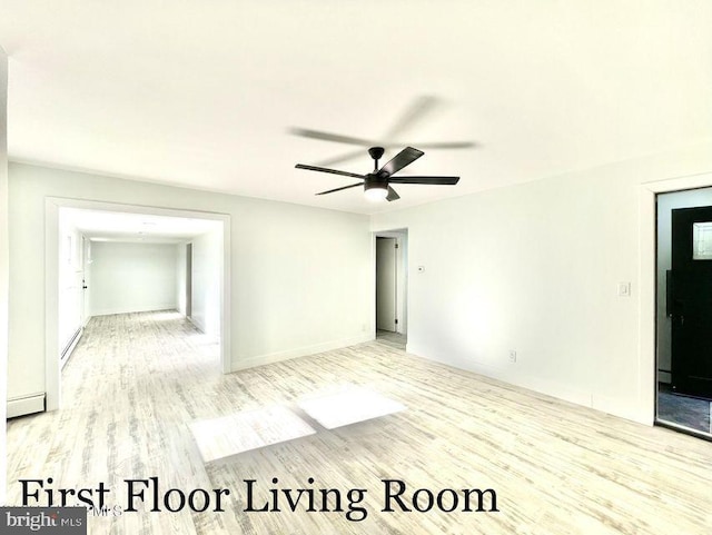 spare room featuring ceiling fan, light wood-type flooring, and a baseboard radiator