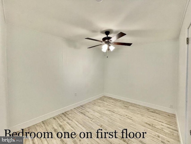 empty room featuring ceiling fan and light hardwood / wood-style floors