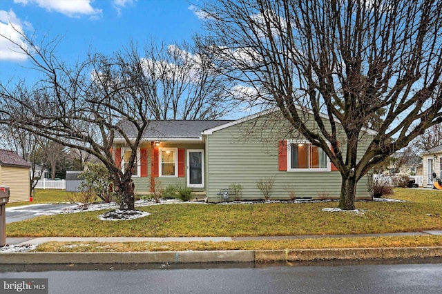 ranch-style house with a front lawn