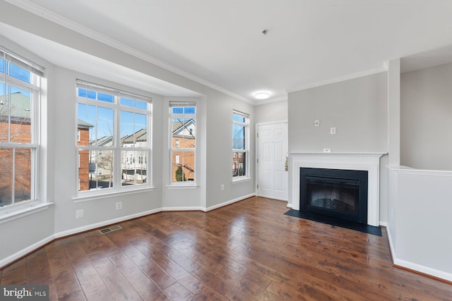 unfurnished living room featuring a fireplace with flush hearth, baseboards, visible vents, and hardwood / wood-style floors