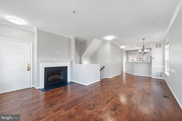 unfurnished living room featuring hardwood / wood-style flooring, baseboards, and visible vents