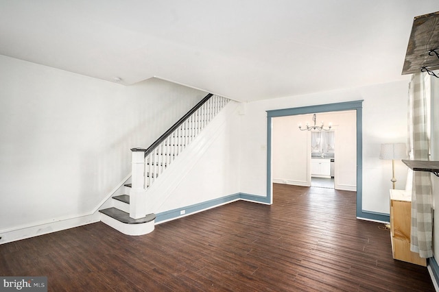 interior space featuring a chandelier and wood-type flooring