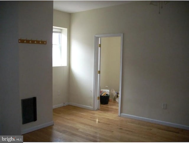 unfurnished room featuring light hardwood / wood-style flooring