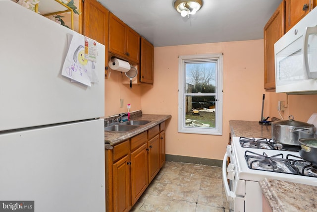 kitchen with sink and white appliances