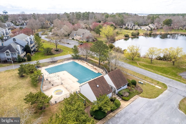 birds eye view of property featuring a residential view and a water view