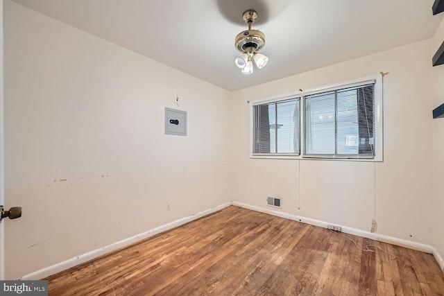 spare room featuring hardwood / wood-style floors