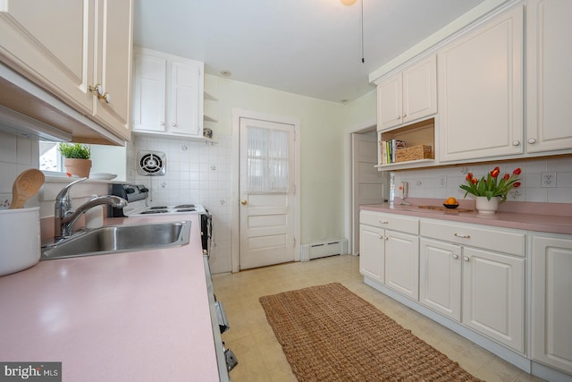 kitchen featuring light countertops, white cabinetry, and open shelves