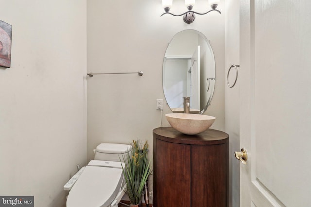 half bath with vanity and toilet