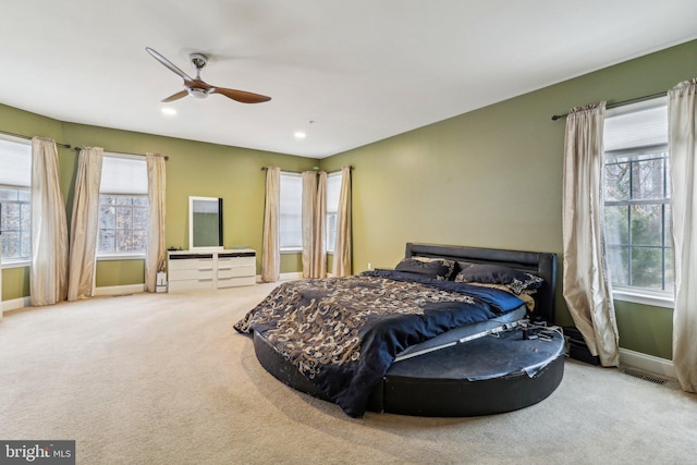 bedroom featuring carpet, multiple windows, baseboards, and recessed lighting