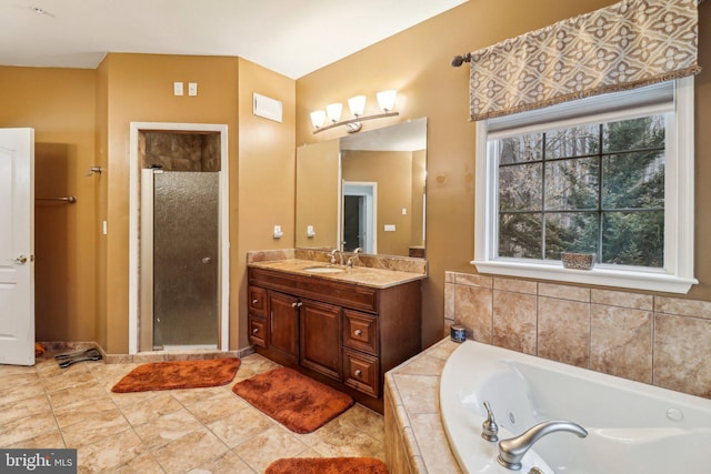 full bath featuring a bath, a stall shower, vanity, and tile patterned floors