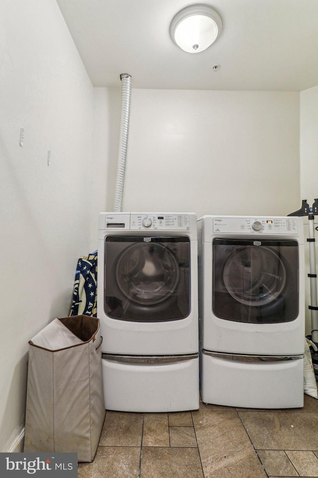 clothes washing area featuring laundry area and independent washer and dryer