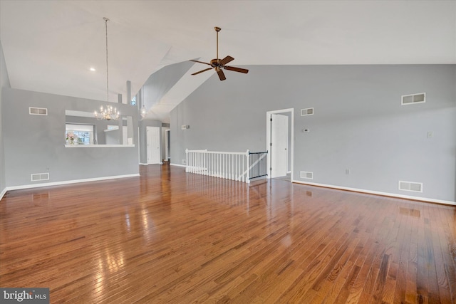 unfurnished living room featuring wood finished floors and visible vents