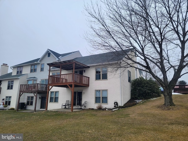 rear view of house featuring a patio, a yard, central air condition unit, a pergola, and stucco siding