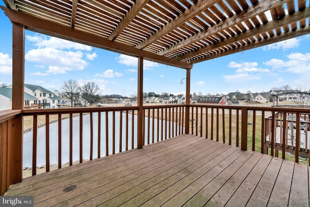 deck featuring a residential view and a pergola