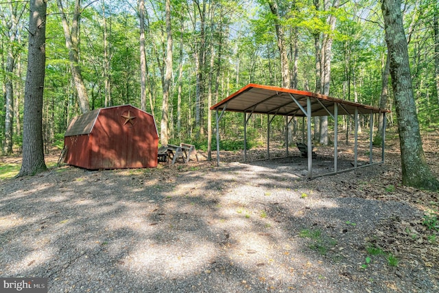 view of yard with a shed and a carport