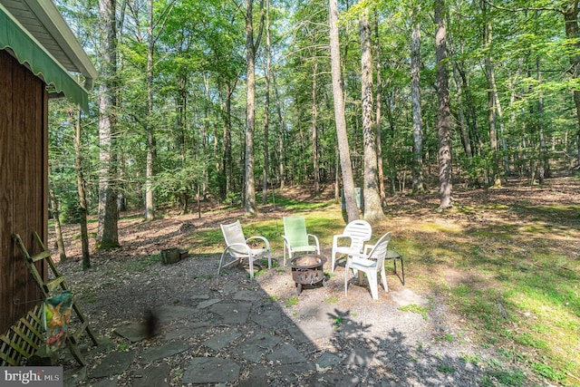 view of yard featuring a patio and a fire pit