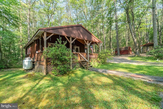 view of outdoor structure with a lawn