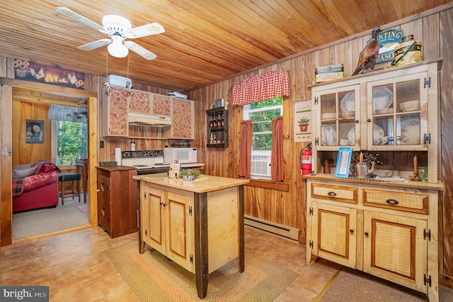 kitchen with a center island, baseboard heating, wooden walls, and wooden ceiling