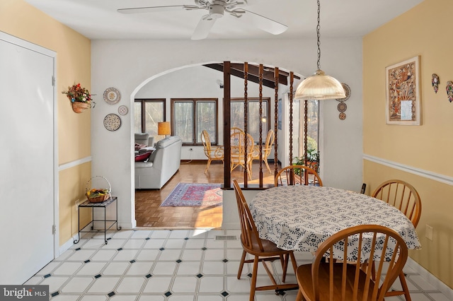 dining area with lofted ceiling, ceiling fan, and baseboards