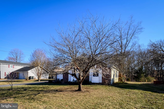 view of home's exterior featuring a lawn