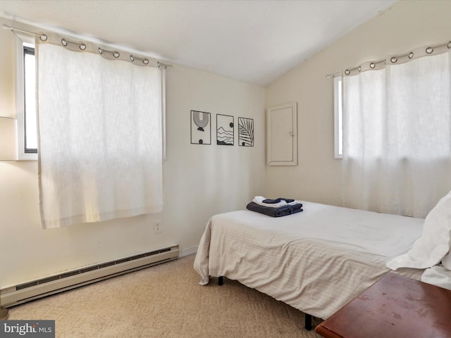 carpeted bedroom with lofted ceiling, multiple windows, and a baseboard radiator