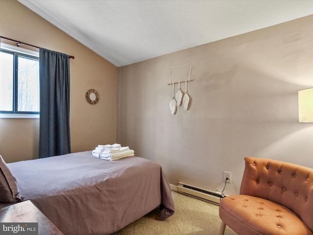 carpeted bedroom featuring a baseboard heating unit and lofted ceiling