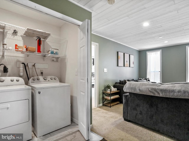 laundry area featuring light carpet, laundry area, washing machine and clothes dryer, crown molding, and recessed lighting