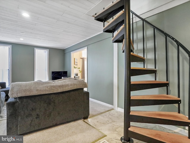 living room featuring stairs, baseboards, and recessed lighting