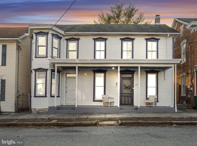 view of property with a porch