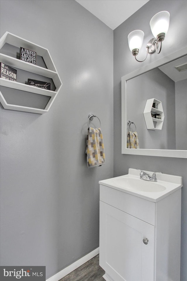 bathroom with vanity and hardwood / wood-style floors