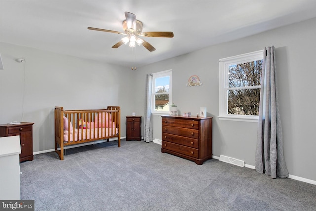 bedroom featuring light carpet and ceiling fan