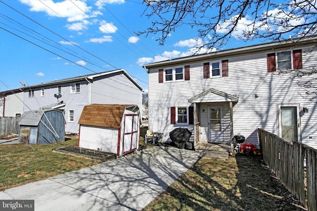 view of front facade with a shed and a front lawn