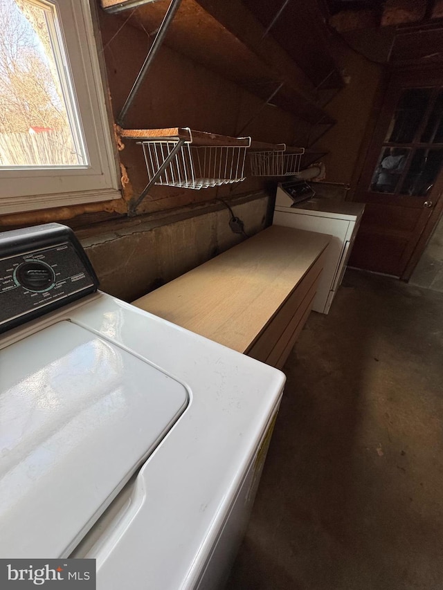 laundry room featuring washer / clothes dryer and laundry area