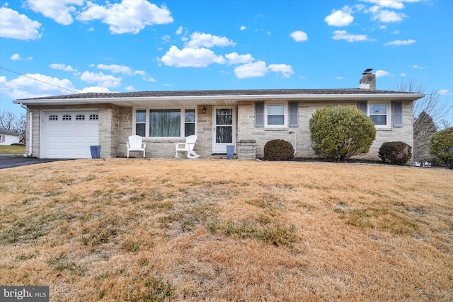 single story home with a garage and a front yard