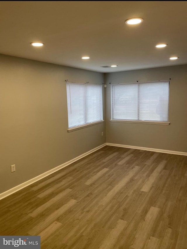 empty room featuring hardwood / wood-style flooring