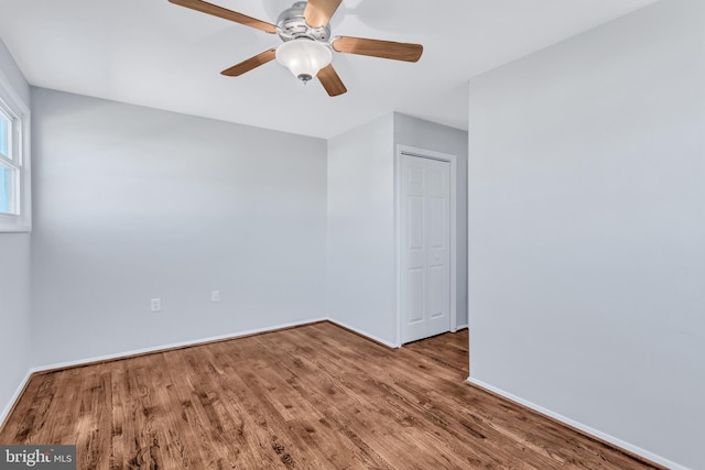 unfurnished room featuring wood-type flooring and ceiling fan