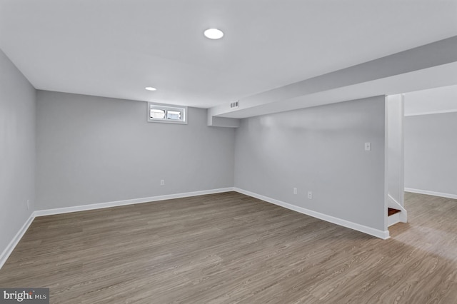 basement featuring hardwood / wood-style floors