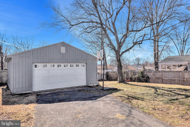 garage featuring a lawn