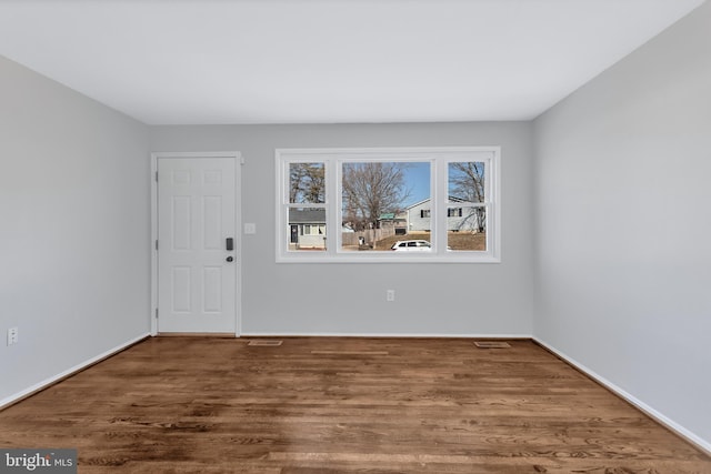 empty room featuring dark hardwood / wood-style floors