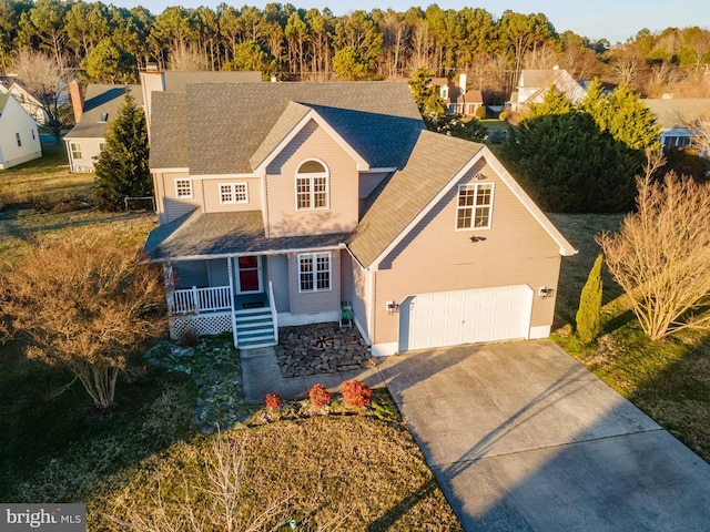 view of front of house with a garage and covered porch