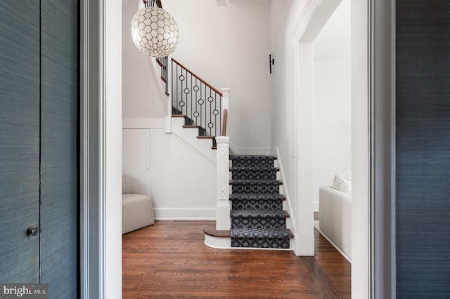 staircase with wood finished floors