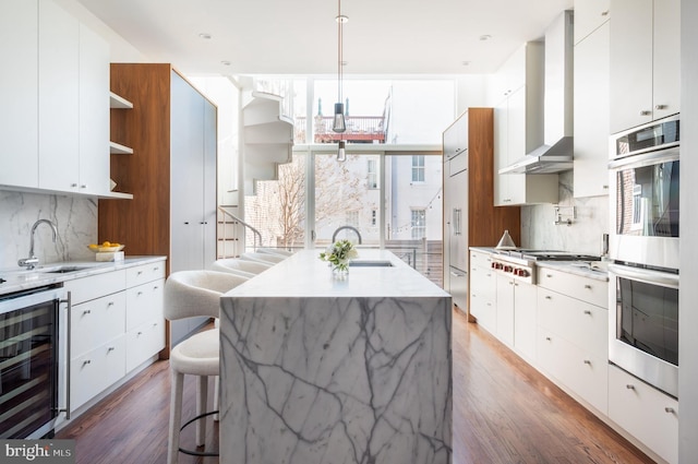 kitchen featuring beverage cooler, appliances with stainless steel finishes, modern cabinets, and open shelves