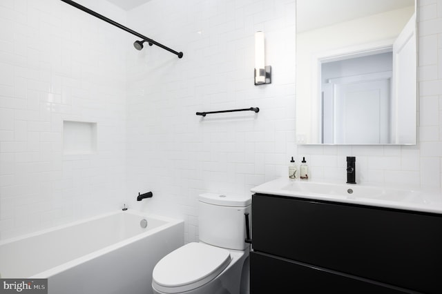 bathroom featuring tasteful backsplash, tile walls, toilet, shower / bathtub combination, and vanity