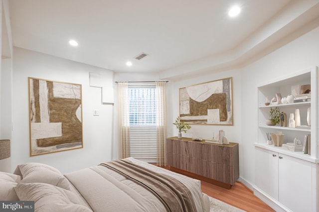 bedroom featuring recessed lighting, visible vents, and light wood-style flooring